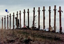 
			
				                                A woman stands among crosses posted on a hill above Columbine High School in Littleton, Colo., in remembrance of the people who died during a school shooting on April 20, 1999.
                                 AP File Photo

			
		